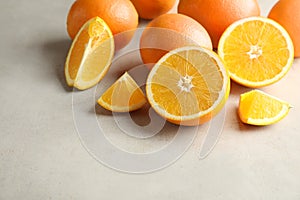 Fresh juicy oranges on table