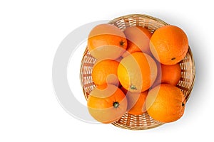 Fresh juicy oranges in wooden basket on white background Top view