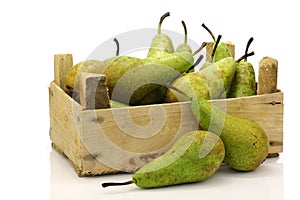 Fresh juicy pears in a wooden box