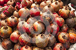 Fresh juicy pomegranates on a counter in the market