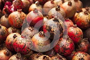 Fresh juicy pomegranates on a counter in the market