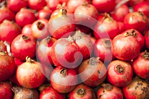 Fresh juicy pomegranates on a counter in the market