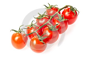 Fresh juicy red cherry tomato bunch closeup isolated on white background.