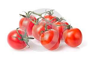 Fresh juicy red cherry tomato bunch closeup isolated on white background