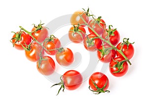 Fresh juicy red cherry tomato bunches closeup isolated on white background.