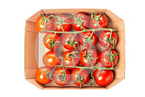 Fresh juicy red cherry tomatoes in a box isolated on white background. Top view.