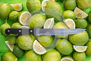 Fresh juicy sliced limes and knife
