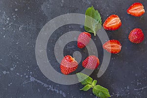 Fresh juicy  strawberry on a dark background. Summer red berries on black