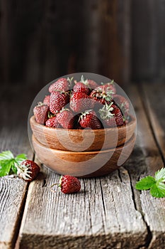 Fresh juicy strawberry on wooden table. Strawberry background