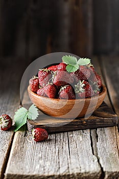 Fresh juicy strawberry on wooden table. Strawberry background