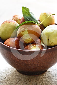 Fresh jujube on wooden table. Unabi fruit