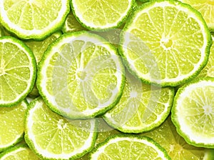 Fresh kaffir lime or bergamot herb fruit slice background