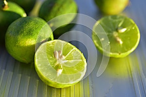Fresh key lime fruit cut in half