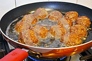 Fresh Kibbeh fired in a frying pan photo