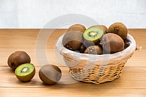 Fresh kiwi fruit in a wicker basket