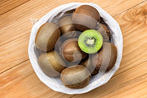 Fresh kiwi fruit in a wickere basket