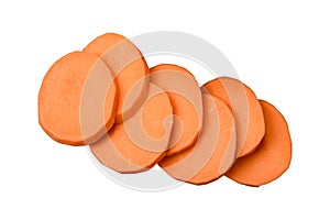 Fresh large pink sweet potato tubers with tomatoes and spices on a dark background