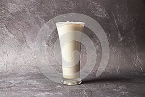 Fresh Lassi or Lachi served in glass isolated on background top view of bangladesh, india and Pakistan drink