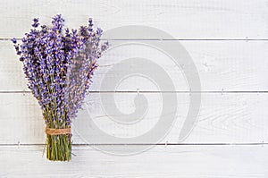 Fresh lavender flowers on white wood table background