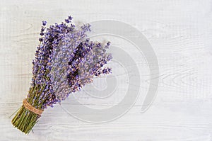 Fresh lavender flowers on white wood table background free space