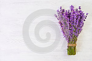 Fresh lavender flowers on white wood table background free space