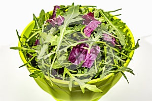 Fresh leaves of arugula and radicchio isolated on white background. Green bamboo salad bowl. Healthy food concept