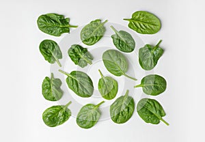 Fresh leaves of spinach isolated on white