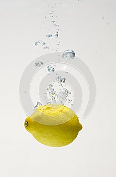 Fresh lemon drop on water with babble