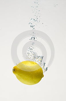 Fresh lemon drop on water with babble