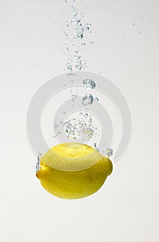 Fresh lemon drop on water with babble