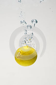 Fresh lemon drop on water with babble