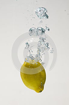 Fresh lemon drop on water with babble