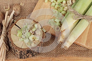 Fresh lemon grass is herb on wood background.