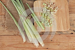 Fresh lemon grass is herb on wood background.