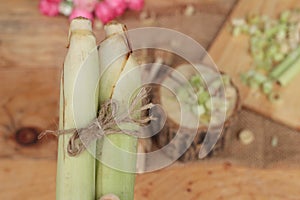 Fresh lemon grass is herb on wood background.