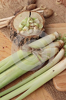 Fresh lemon grass is herb on wood background.