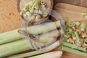 Fresh lemon grass is herb on wood background.