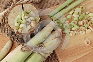 Fresh lemon grass is herb on wood background.