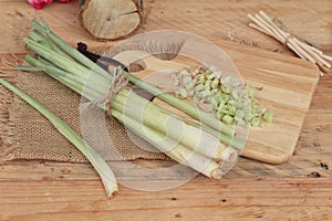 Fresh lemon grass is herb on wood background.