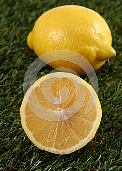 Fresh lemon laying on green grass