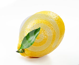 Fresh lemon with slice and leaf isolated white background