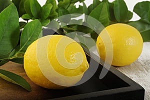 Fresh lemon on wooden background