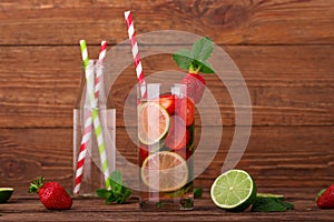 Fresh lemonade with strawberries, lime and mint