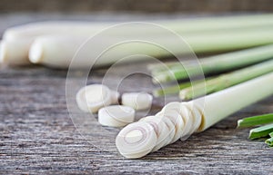 Fresh lemongrass slices on wooden background - Spice for health.