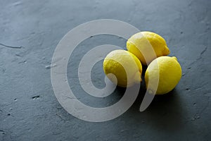 Fresh lemons on black background