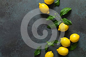 Fresh lemons with leaves on white wooden background,  summer lemonade ingredient, vitamin c concept