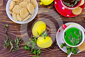 Fresh lemons, mint tea - green tea and tea cakes