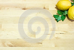 Fresh Lemons and mint on wooden board. Healthy food concept for vegetarian, vegan, raw, frutarian, gluten free, weight loss diet.