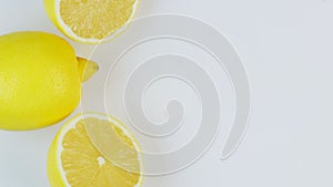 Fresh lemons rotating in a circle, white background, and space for text.