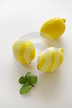 Fresh lemons on white background